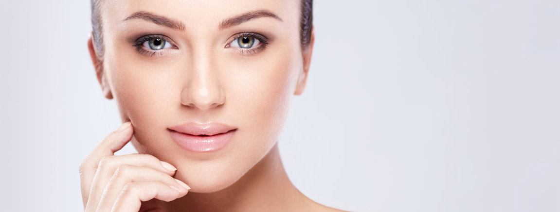 1 Beautiful woman holding her face