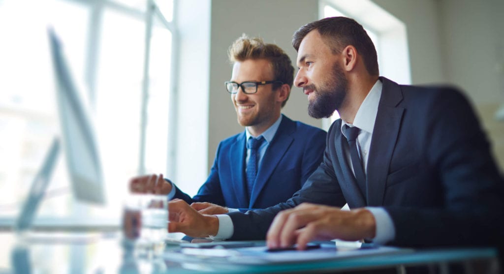 Male employees working in office