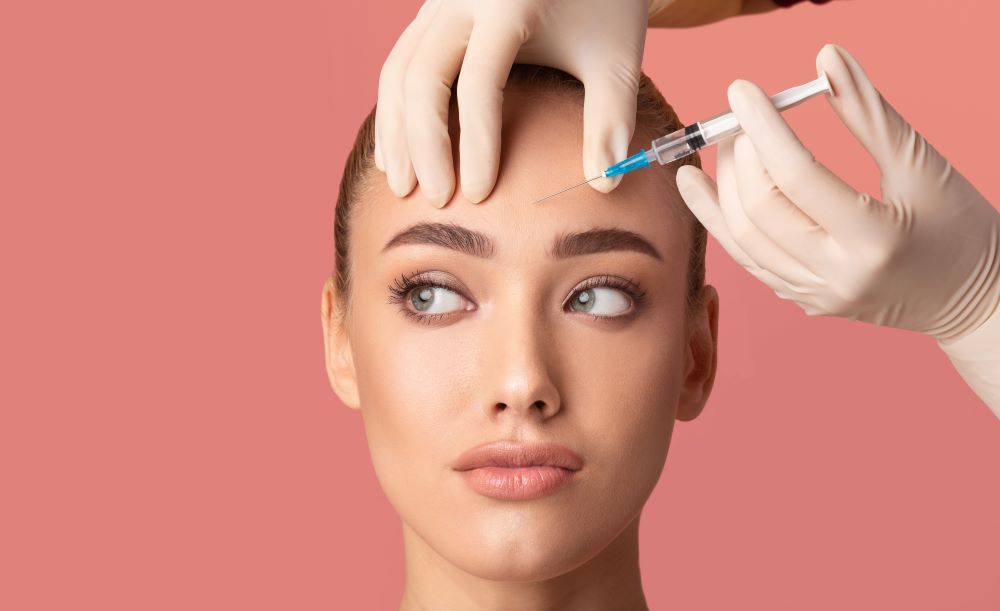 A woman receiving Botox by her injector.