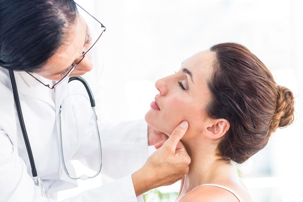 woman discussing botox with her doctor to treat TMJ