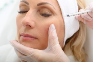 Woman getting botox to reduce tired eyes in Los Angeles