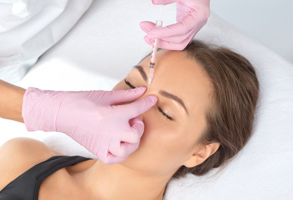 Woman getting botox in between her eyebrows in los angeles, California