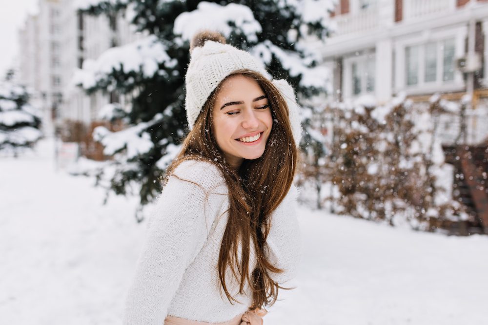 woman after facial laser hair removal appointment in the winter