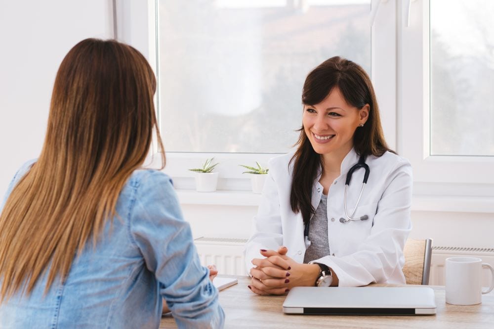 Patient talking to doctor