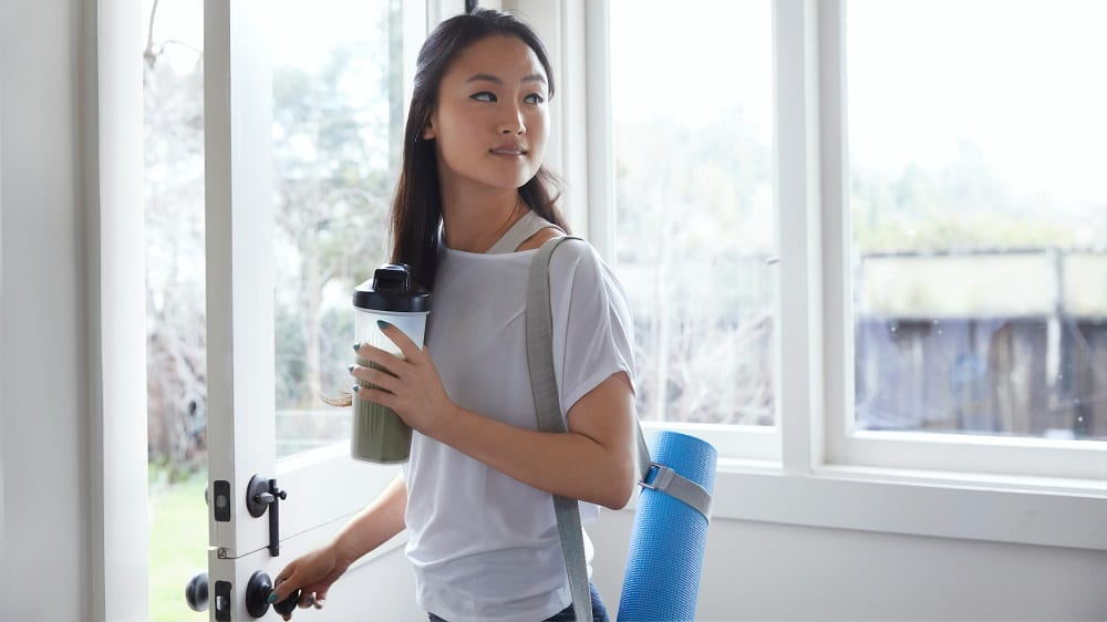 Woman holding a tumbler