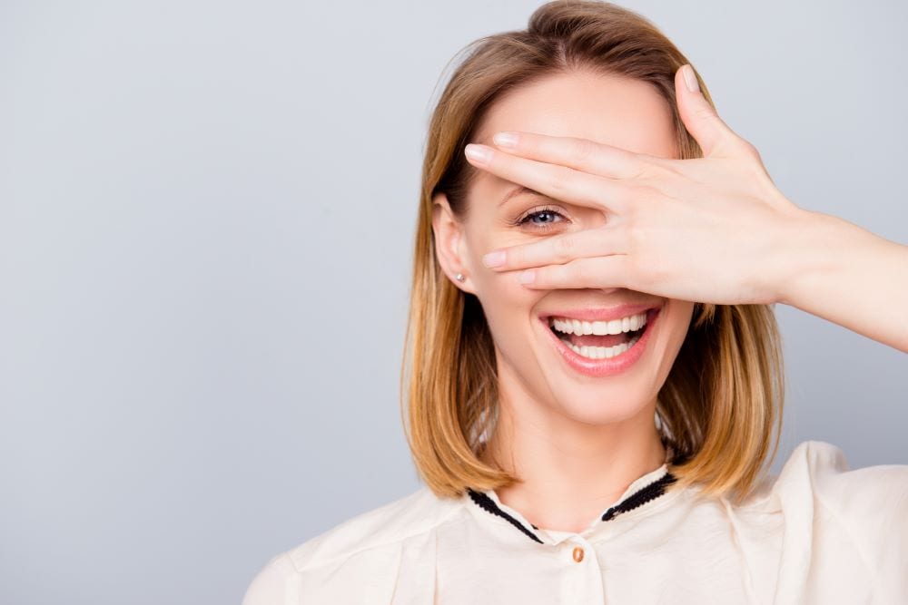 Woman covering her one eye